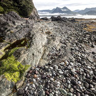 photo of rugged west coast shoreline, ocean, and mountains in Kyuquot, BC